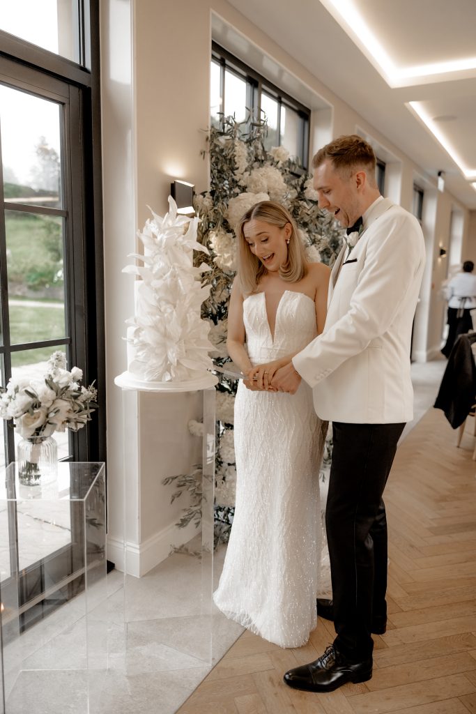 Cutting of a beautiful wedding cake