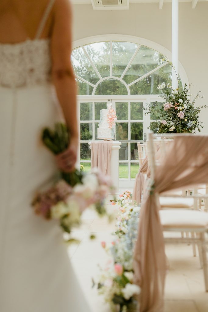 Wedding cakes in Leicester - this cake matched perfectly to a beautiful venue. Luxury and elegant wedding cake as the bride enters this space.