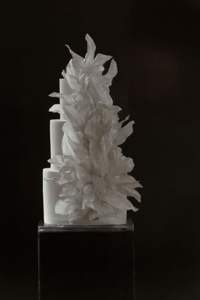 Modern wedding cake with sculpted edible petals in an artistic, high-fashion design. Exceptional Wedding Cakes Loughborough