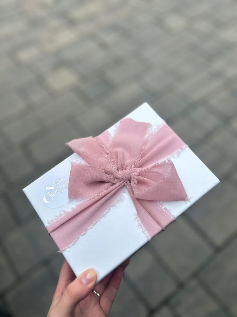 A thoughtful welcome gift sent by Sugar Creations by Dimple to couples after booking their luxury wedding cake.