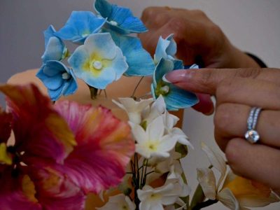 Dimple assembling this beautiful wedding cake at the bride and groom's wedding venue